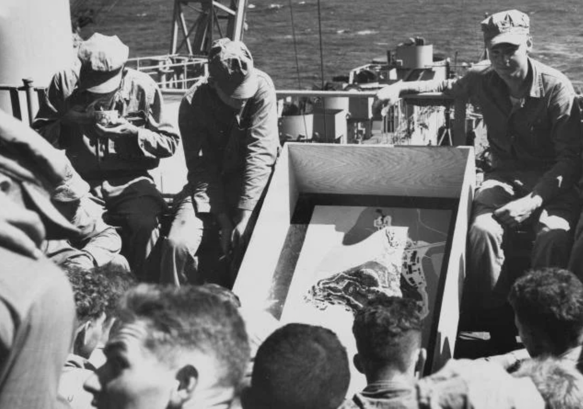 Marines review the plan for the amphibious invasion of Inchon during the Korean War. 